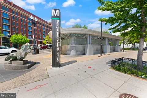 a picture of a bench in front of a building