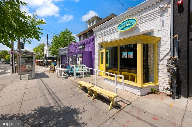 a view of a house with sitting area and a yard