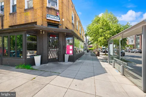 an outdoor space with furniture and umbrella