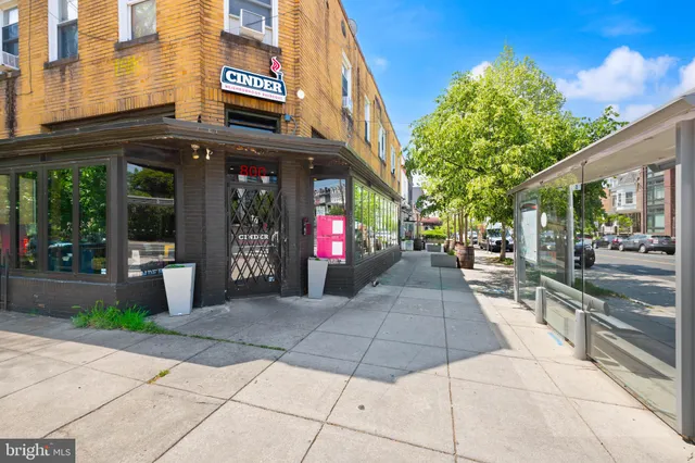 an outdoor space with furniture and umbrella