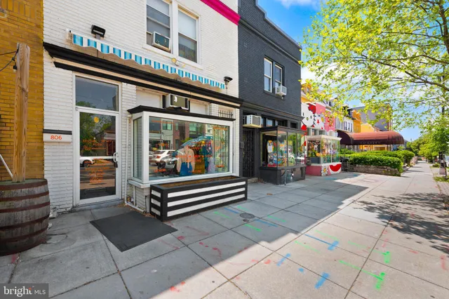 a view of street with sitting area