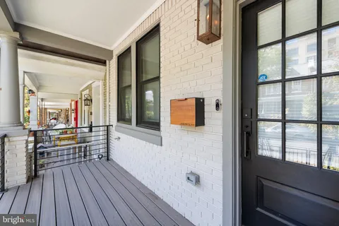 a hallway with wooden floor