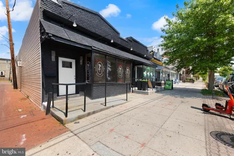 a view of a building with sitting area