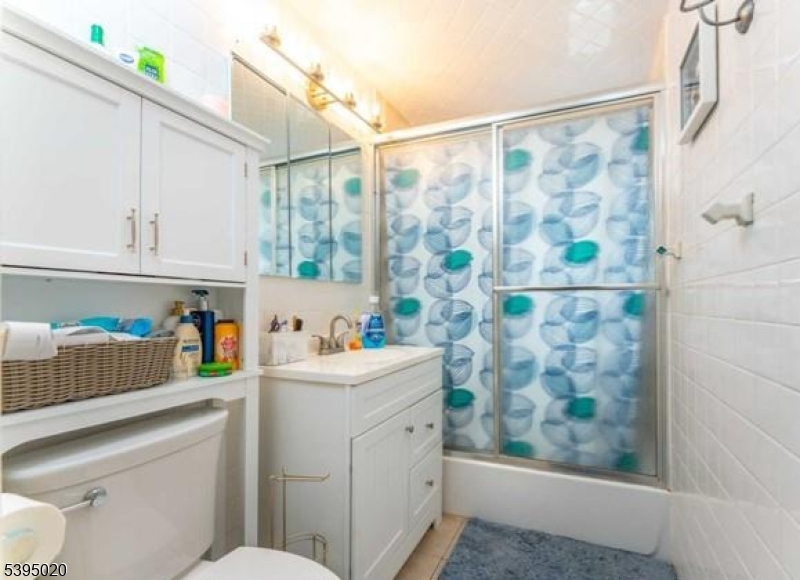 220 North 17th Street Bloomfield, NJ 07003 - Photo 13 of 19 a utility room with stainless steel appliances wooden floor and window