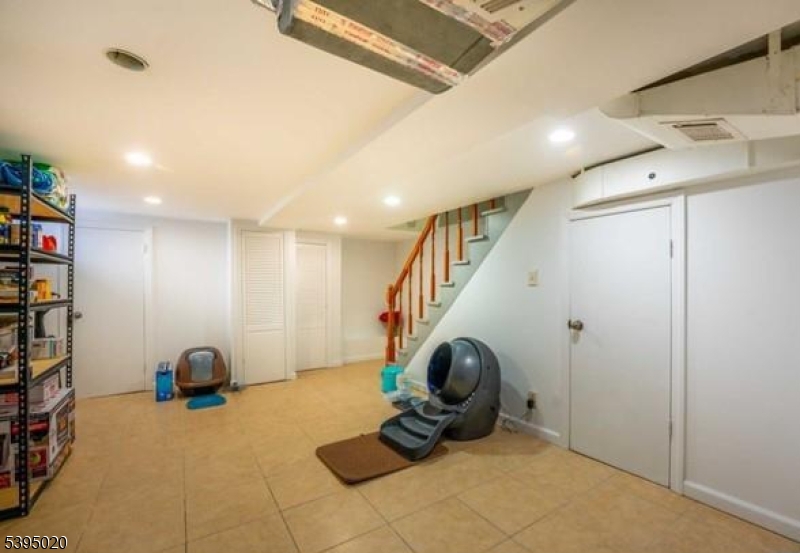 220 North 17th Street Bloomfield, NJ 07003 - Photo 14 of 19 a room with lots of white furniture and stairs