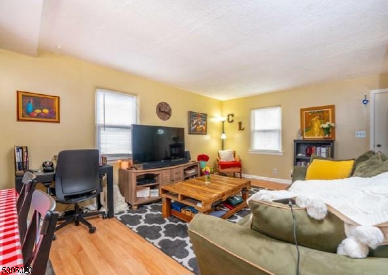 220 North 17th Street Bloomfield, NJ 07003 - Photo 4 of 19 a living room with furniture and a flat screen tv