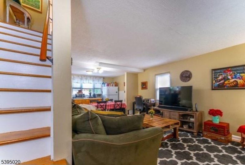 220 North 17th Street Bloomfield, NJ 07003 - Photo 6 of 19 a living room with furniture and a flat screen tv