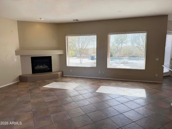 a view of a kitchen with a sink and a window