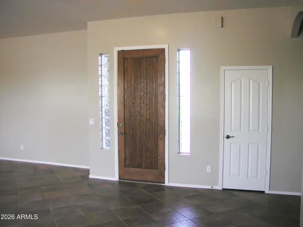 an empty room with wooden floor