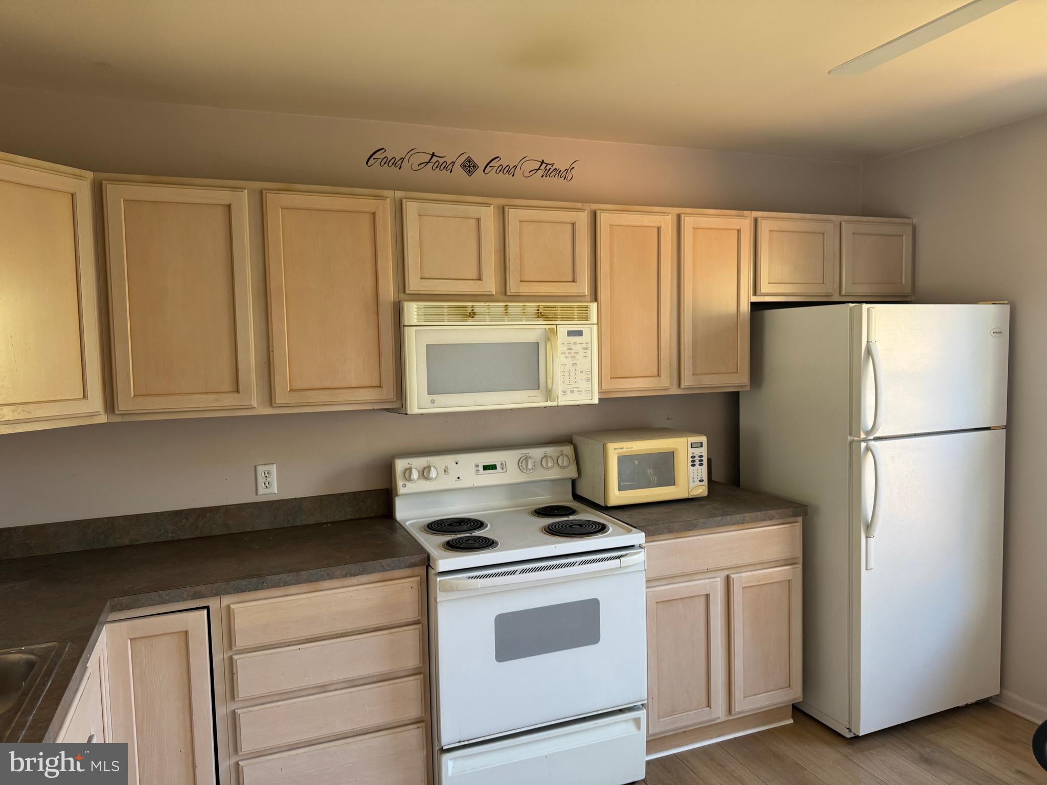 229 Wheatfield Way, Unit 76C York, PA 17403 - Photo 14 of 24 a kitchen with stainless steel appliances white cabinets and a refrigerator