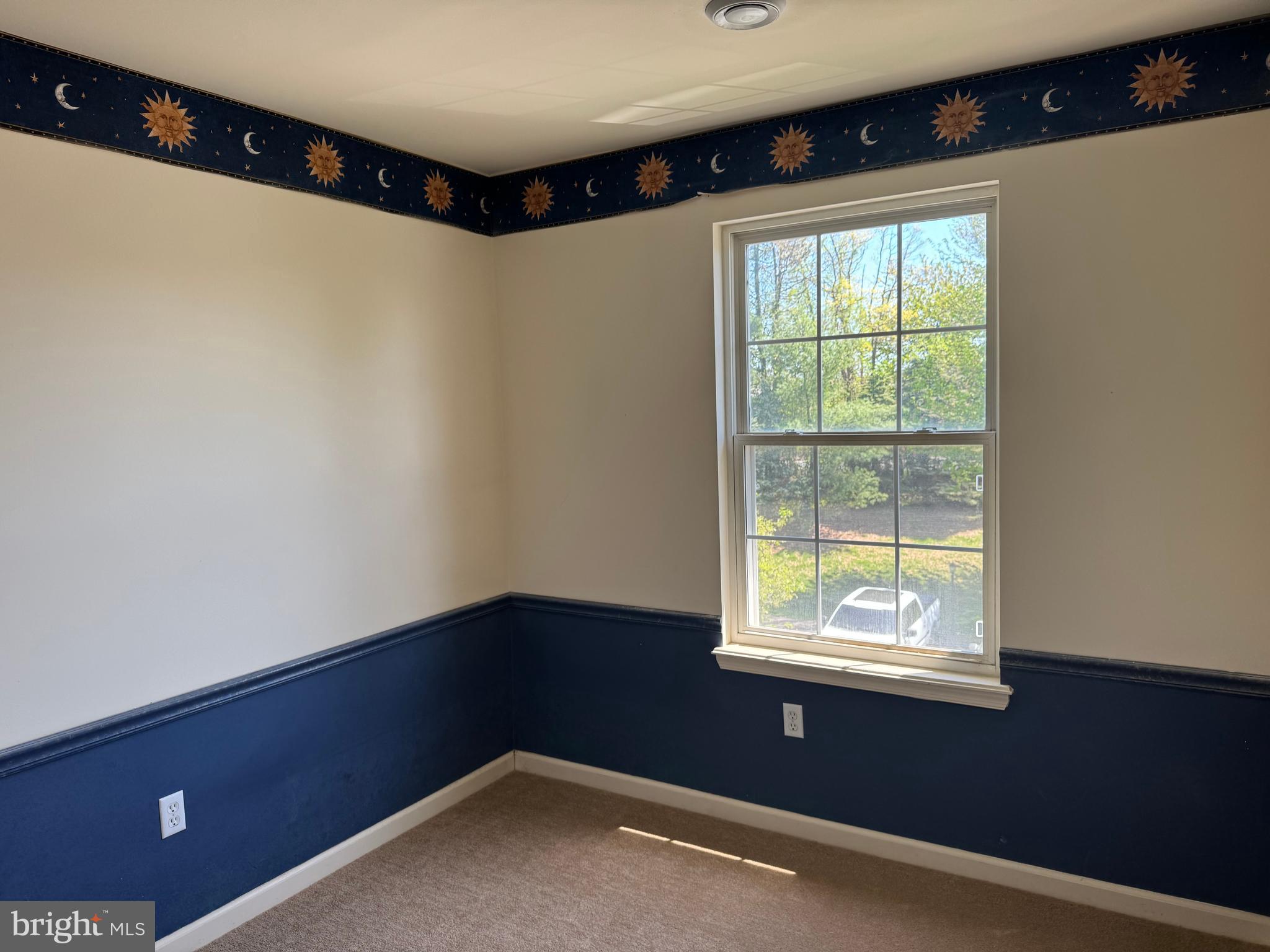 229 Wheatfield Way, Unit 76C York, PA 17403 - Photo 21 of 24 a view of an empty room with a window