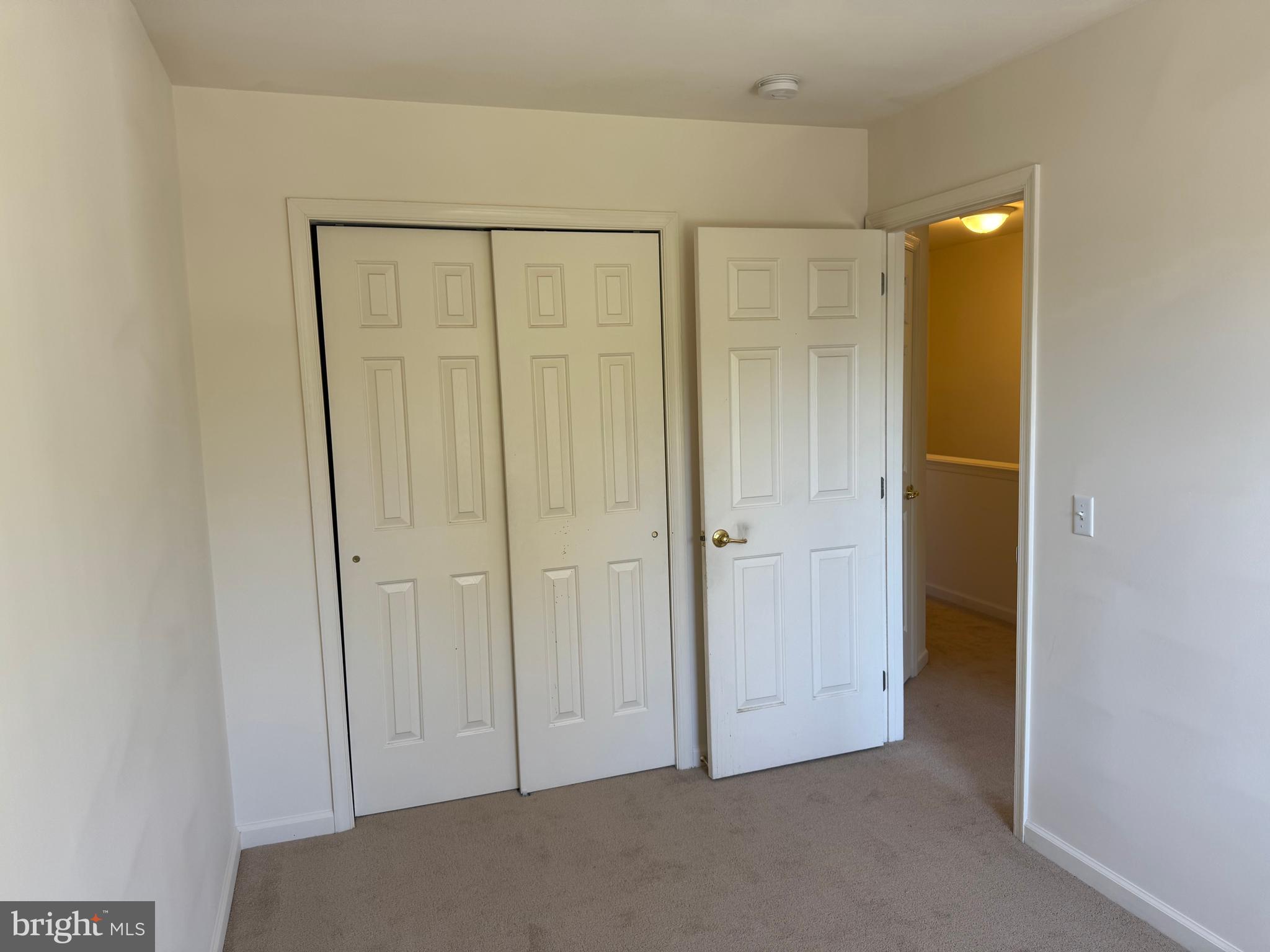 229 Wheatfield Way, Unit 76C York, PA 17403 - Photo 24 of 24 a view of an empty room with closet and a bathroom