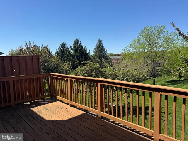 a view of balcony with wooden fence