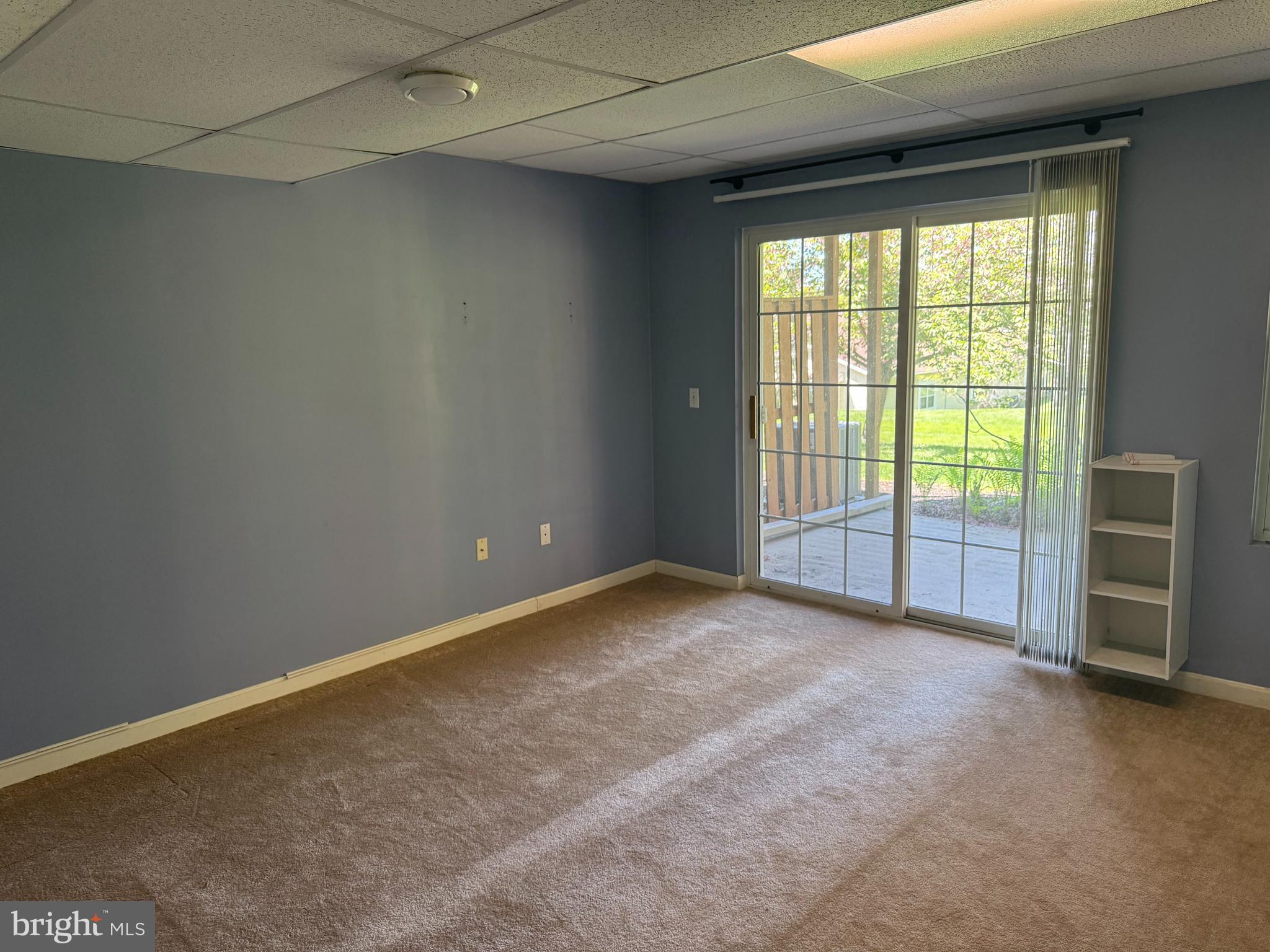 229 Wheatfield Way, Unit 76C York, PA 17403 - Photo 8 of 24 a view of an empty room with a window