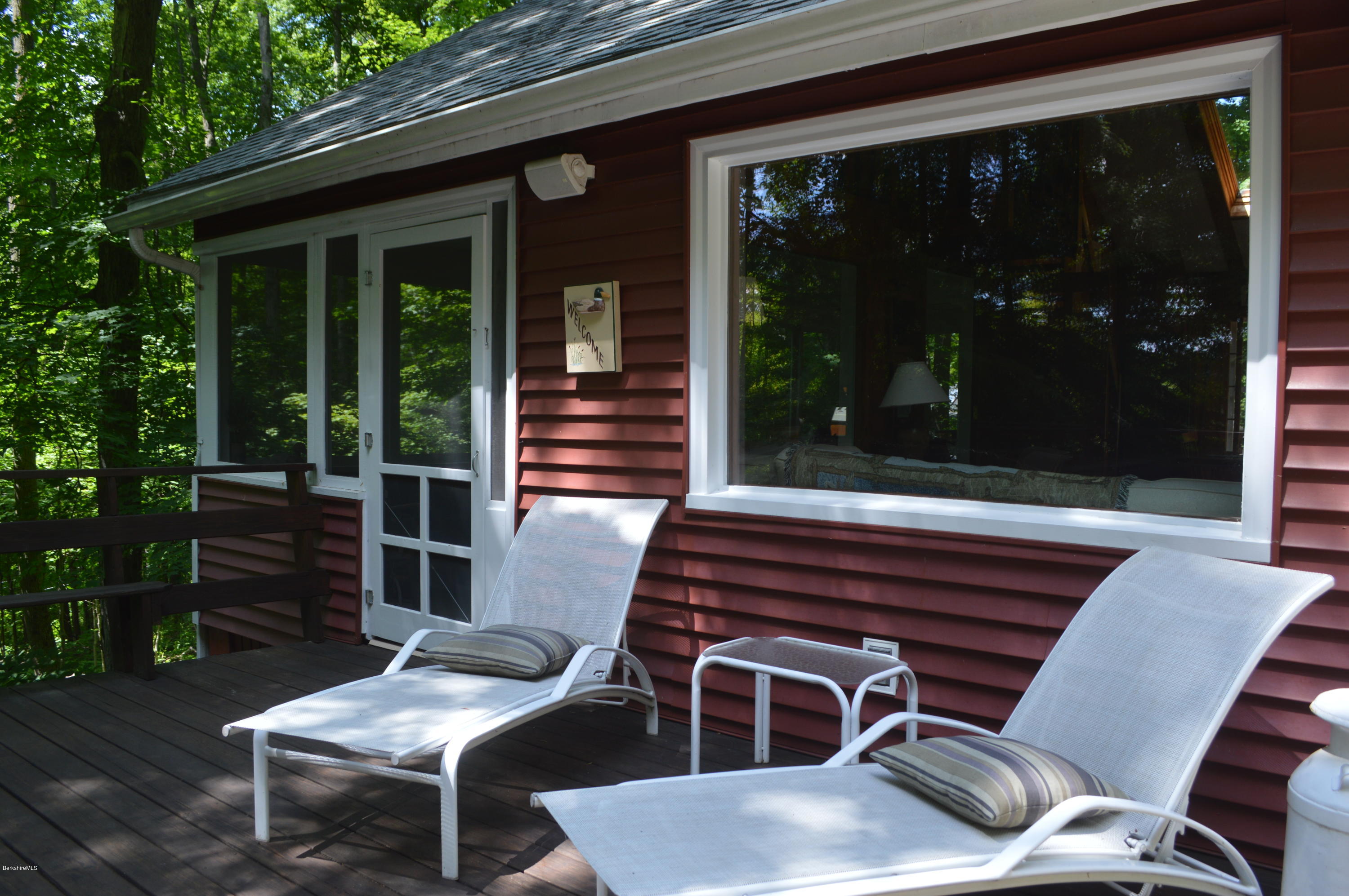 2 Massasoit Road Stockbridge, MA 01262 - Photo 14 of 31 a patio with table and chairs