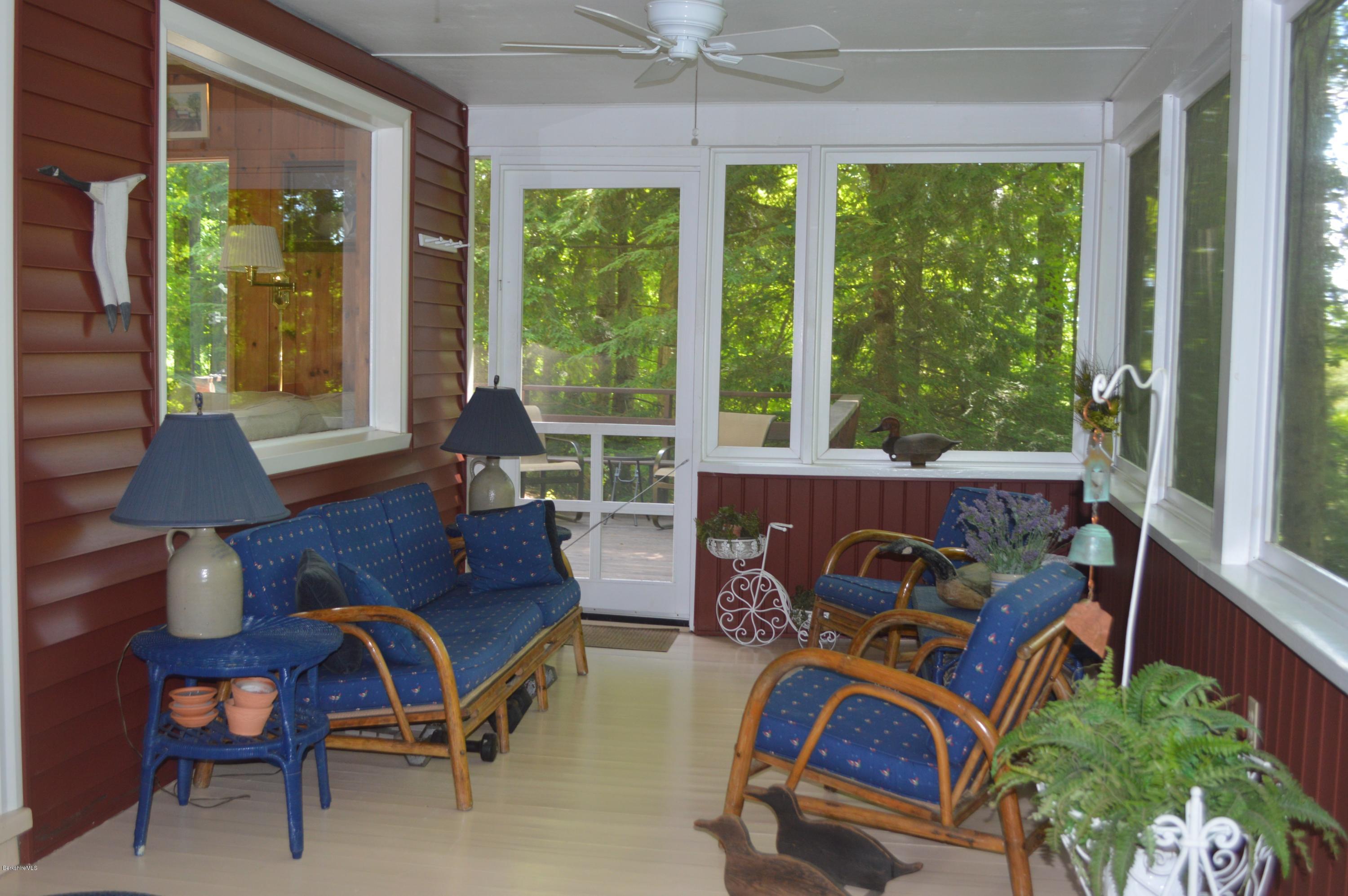 2 Massasoit Road Stockbridge, MA 01262 - Photo 4 of 31 a living room with furniture and a floor to ceiling window