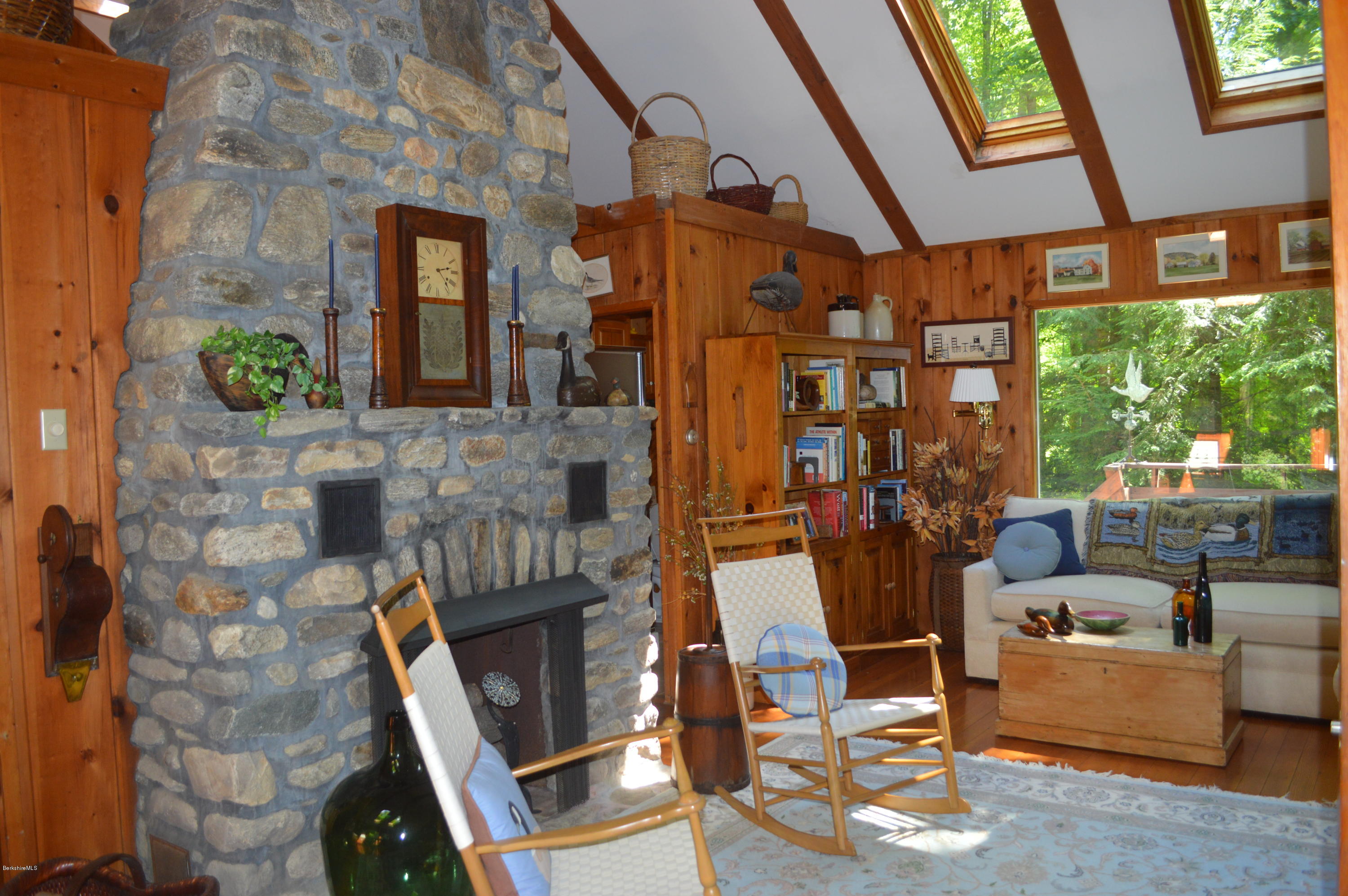 2 Massasoit Road Stockbridge, MA 01262 - Photo 5 of 31 a front view of a house with outdoor seating