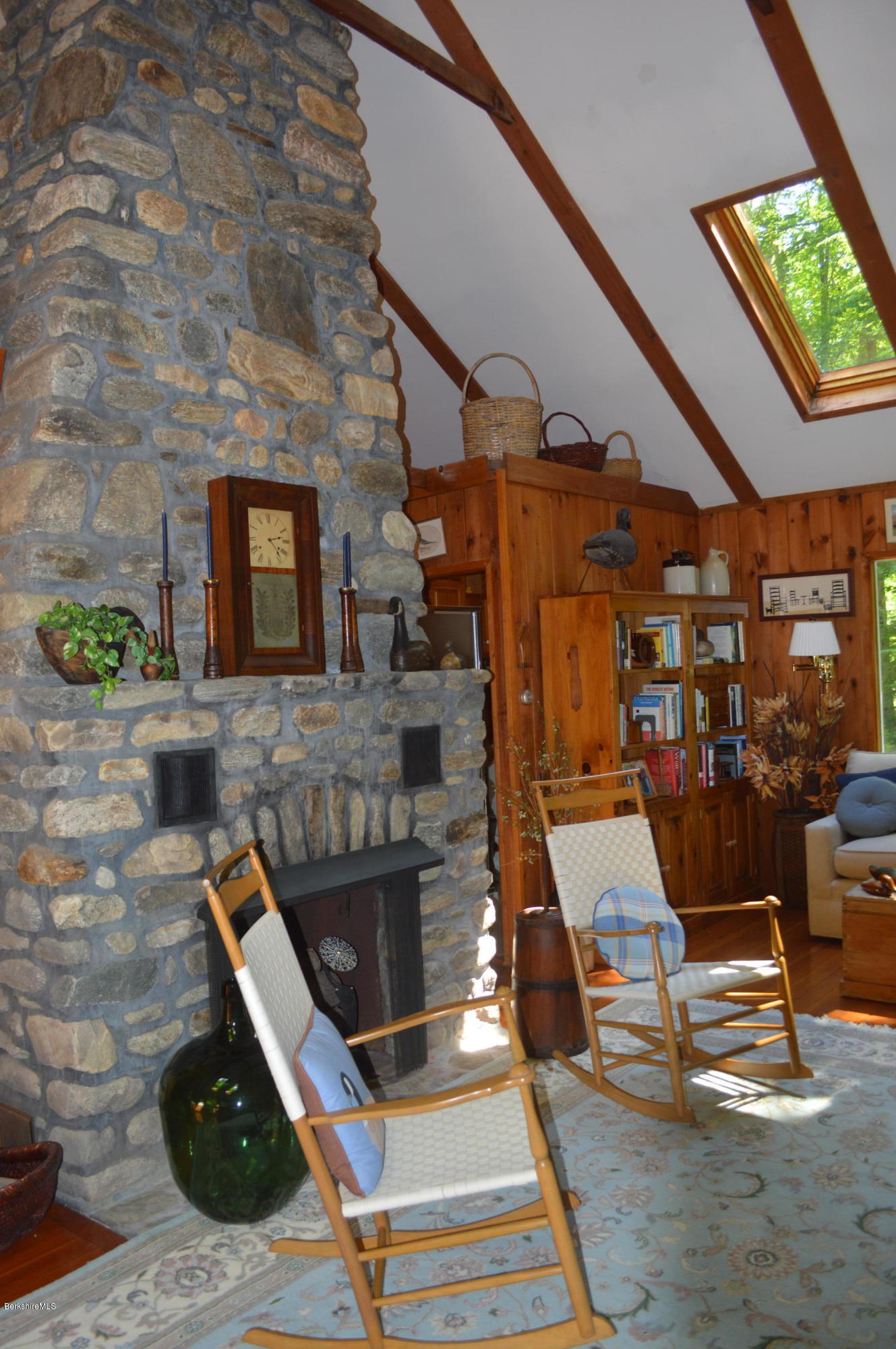 2 Massasoit Road Stockbridge, MA 01262 - Photo 6 of 31 a living room with a fireplace
