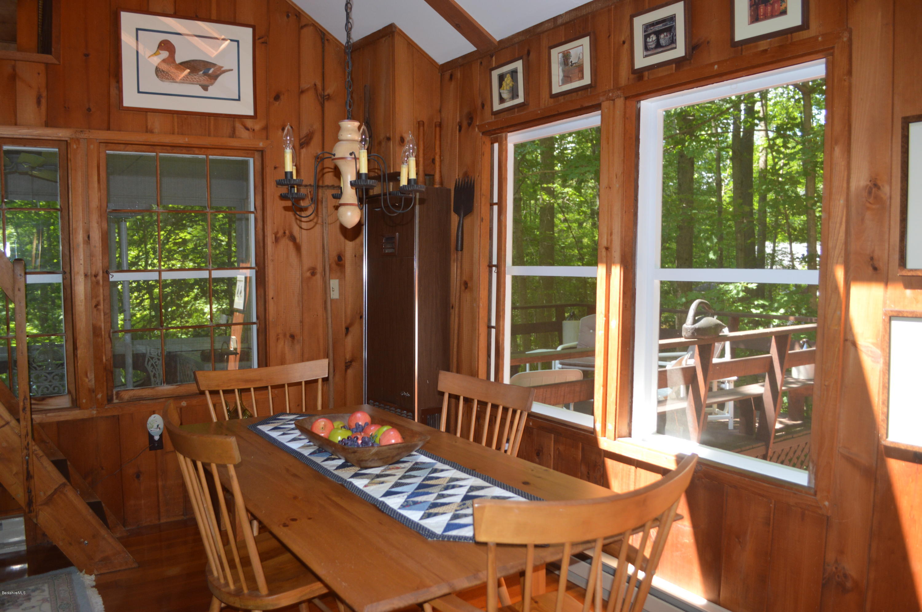 2 Massasoit Road Stockbridge, MA 01262 - Photo 8 of 31 a view of a dining room with furniture large windows and wooden floor
