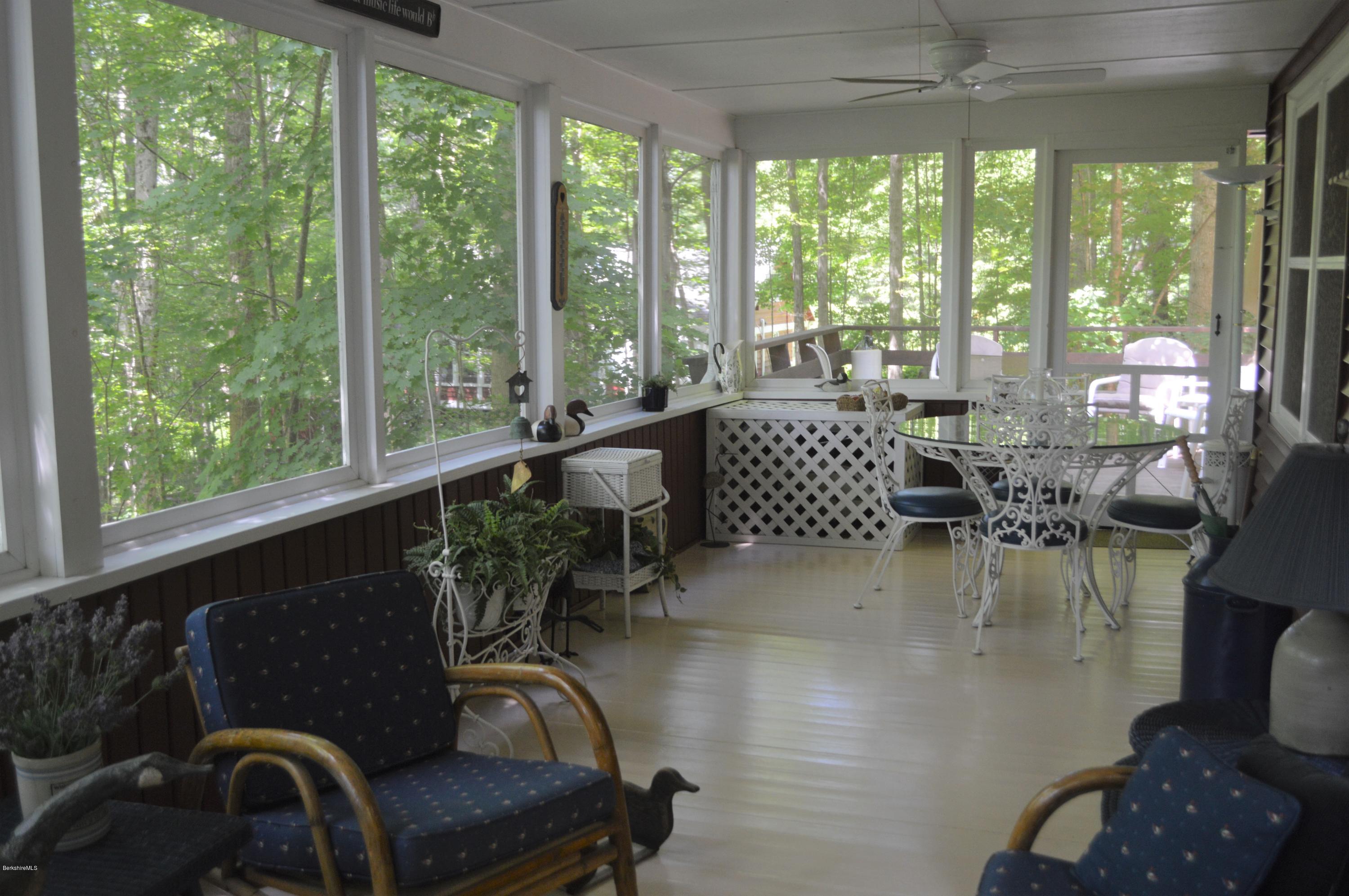 2 Massasoit Road Stockbridge, MA 01262 - Photo 10 of 31 a living room with furniture and floor to ceiling windows