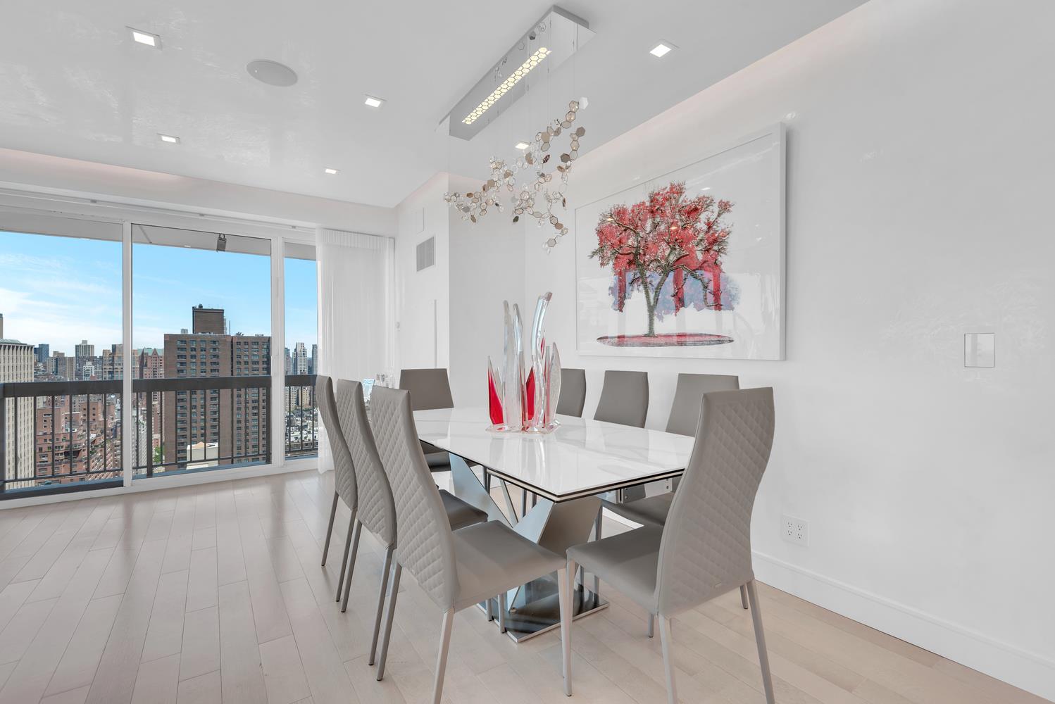 200 East 69th Street, Unit 31A Manhattan, NY 10021 - Photo 4 of 19 a view of a dining room with furniture