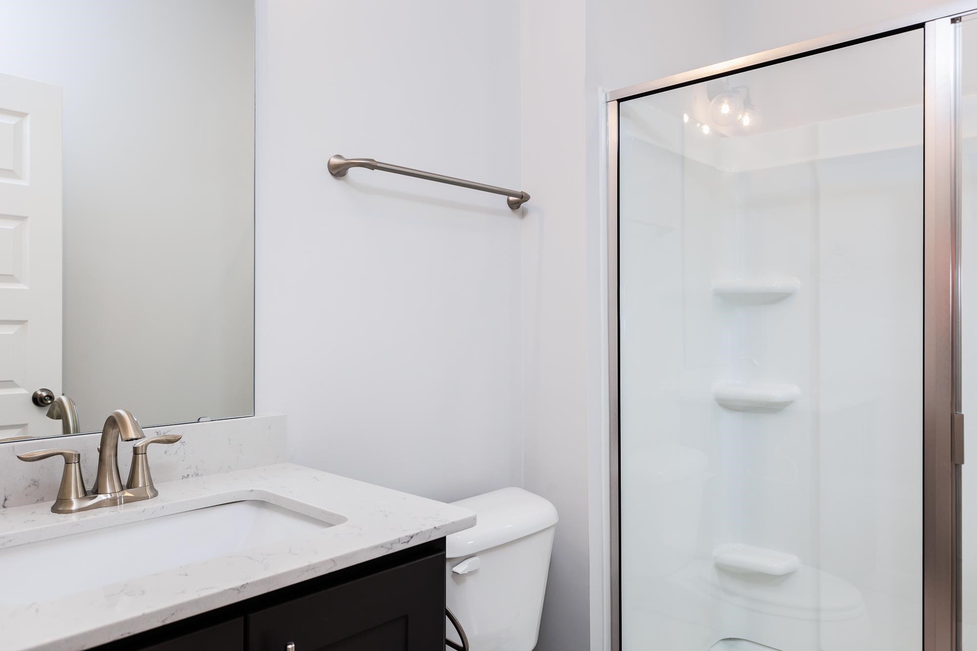 8520 Silsbee Drive Raleigh, NC 27613 - Photo 11 of 18 a bathroom with a sink a toilet and shower