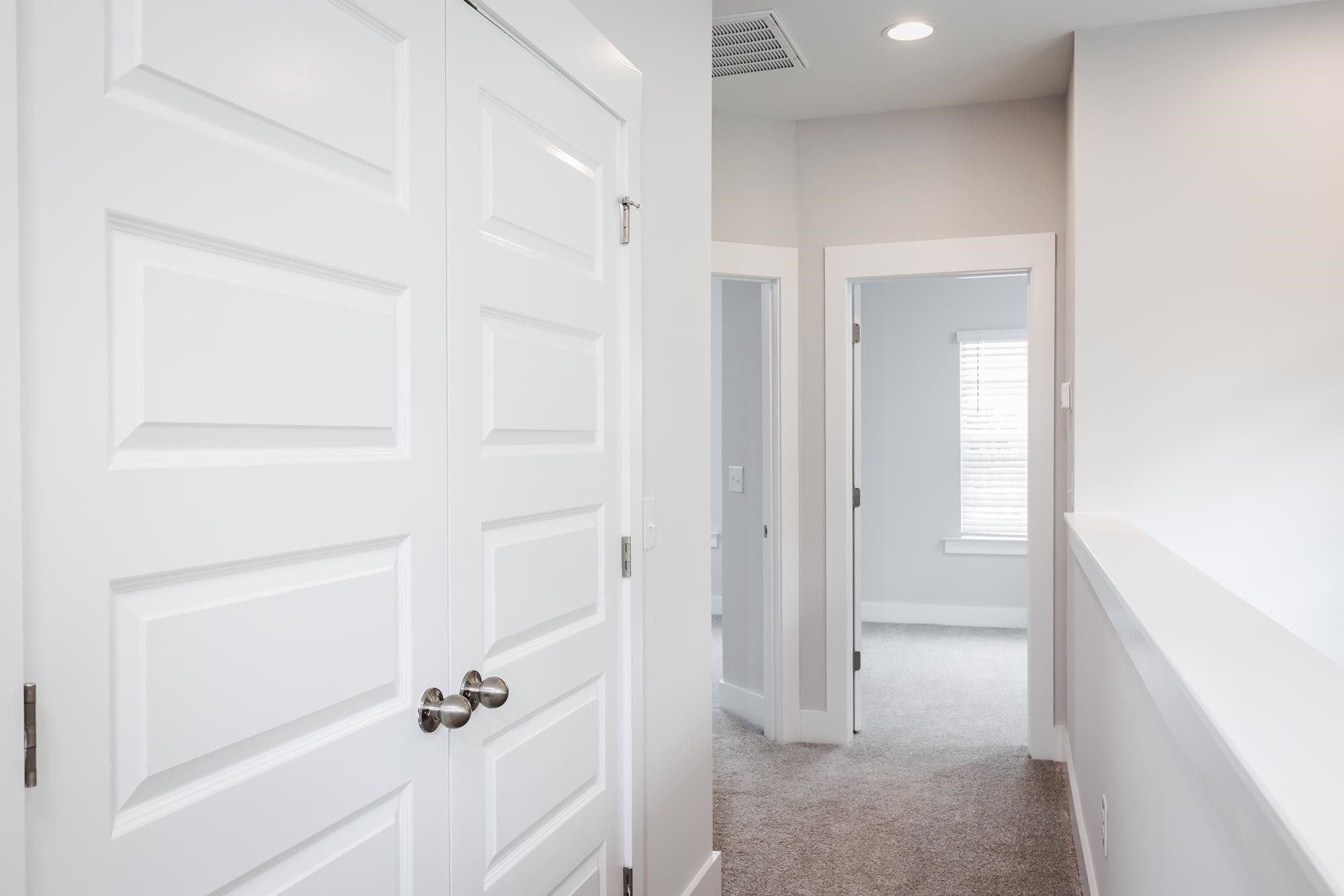 8520 Silsbee Drive Raleigh, NC 27613 - Photo 15 of 18 a view of a hallway with white walls