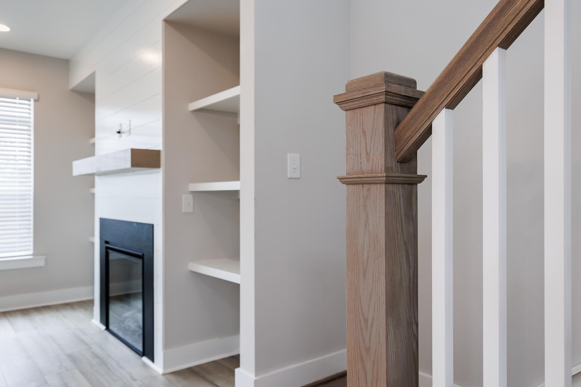 8520 Silsbee Drive Raleigh, NC 27613 - Photo 2 of 18 a view of hallway with stairs and wooden floor