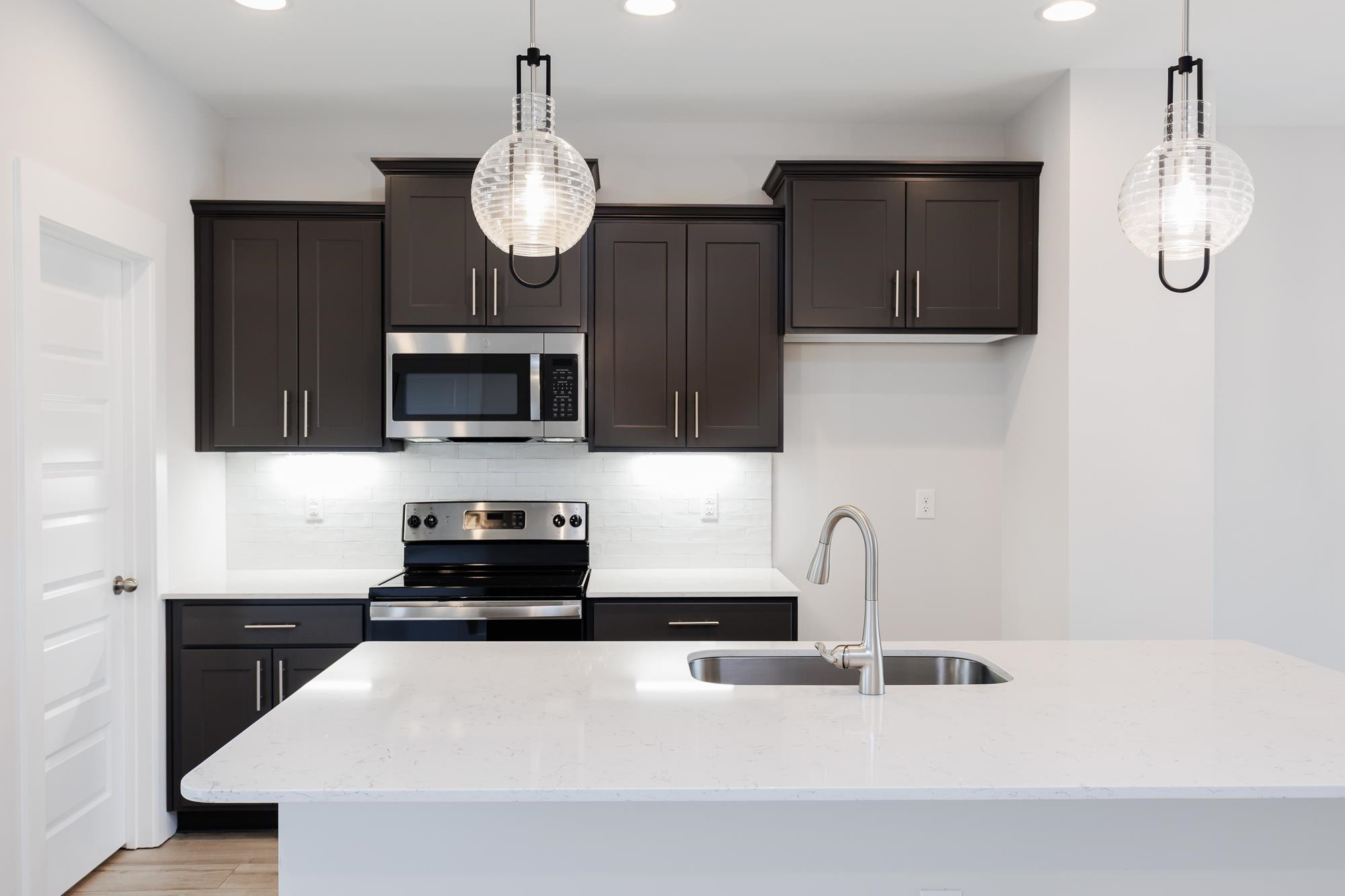 8520 Silsbee Drive Raleigh, NC 27613 - Photo 5 of 18 a kitchen with granite countertop a sink stainless steel appliances and cabinets