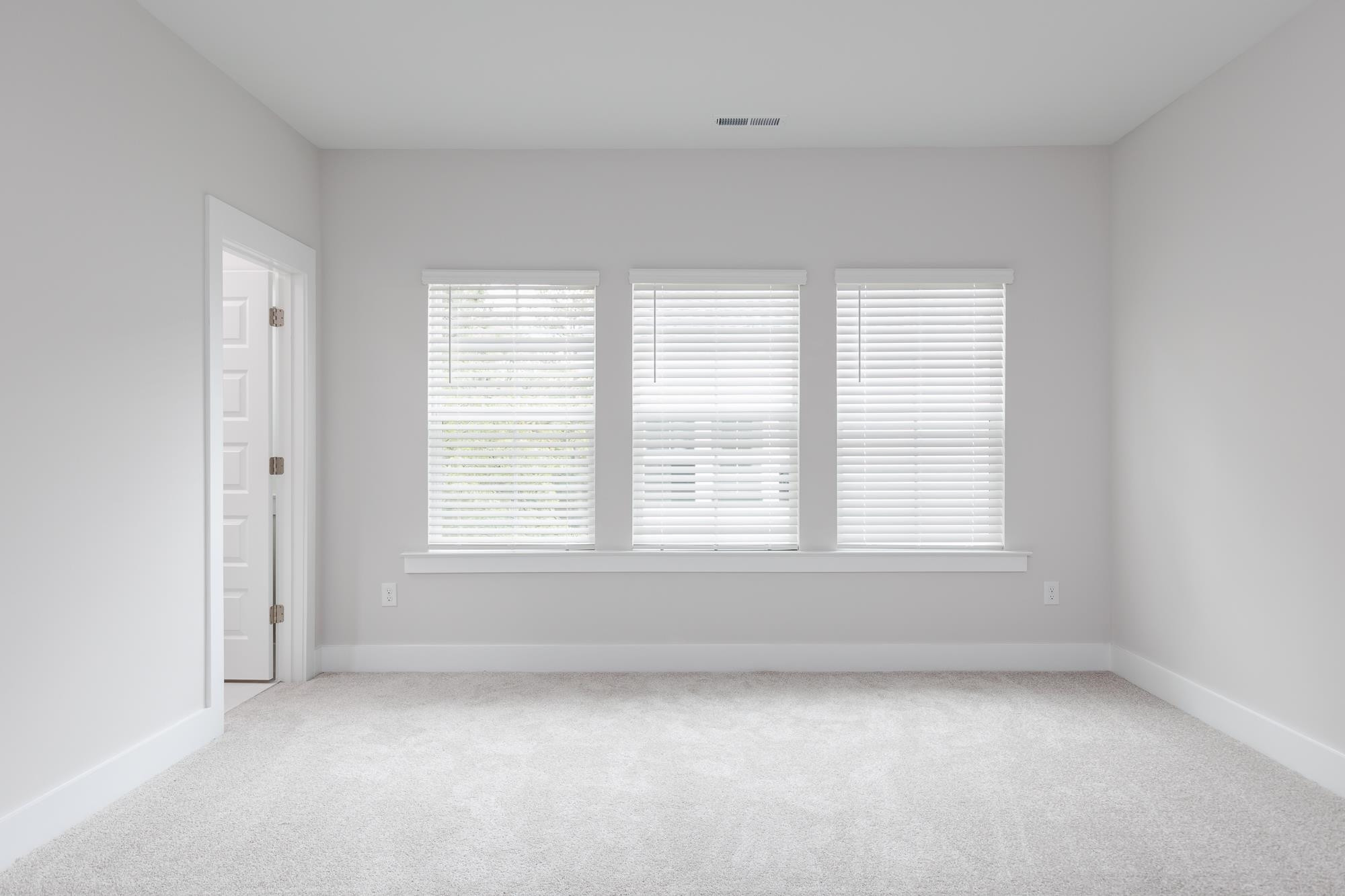 8520 Silsbee Drive Raleigh, NC 27613 - Photo 7 of 18 an empty room with a window