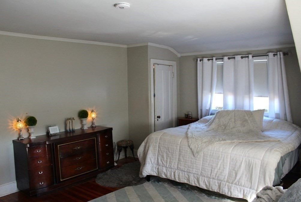 22 Howe Street Hingham, MA 02043 - Photo 11 of 12 a bedroom with a bed and a window