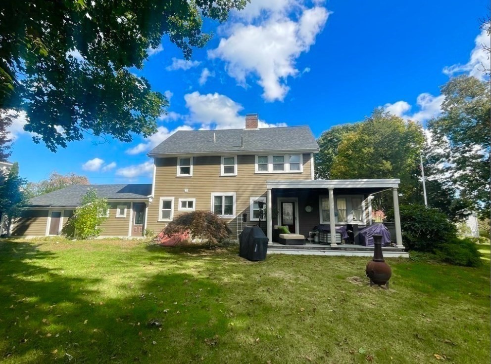 22 Howe Street Hingham, MA 02043 - Photo 4 of 12 a front view of house with yard and outdoor seating