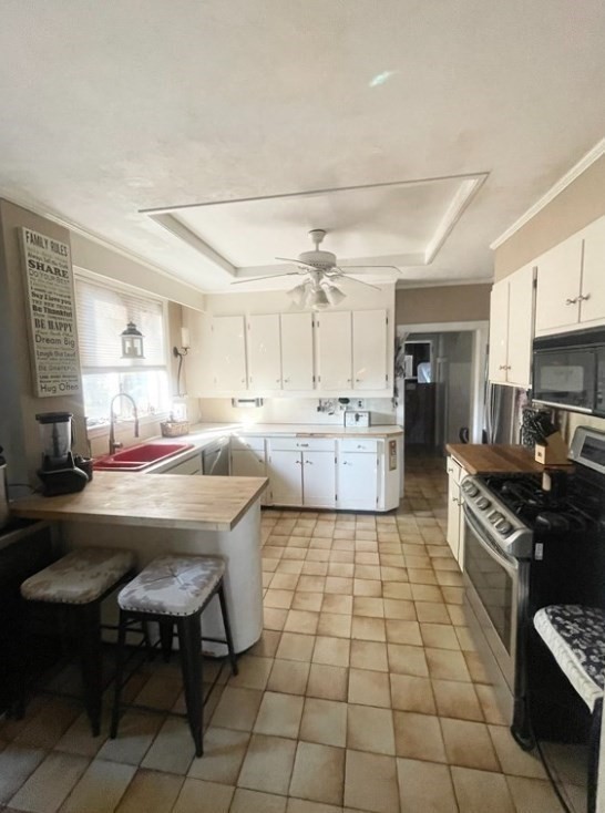 22 Howe Street Hingham, MA 02043 - Photo 7 of 12 a kitchen with stainless steel appliances kitchen island granite countertop a sink and cabinets