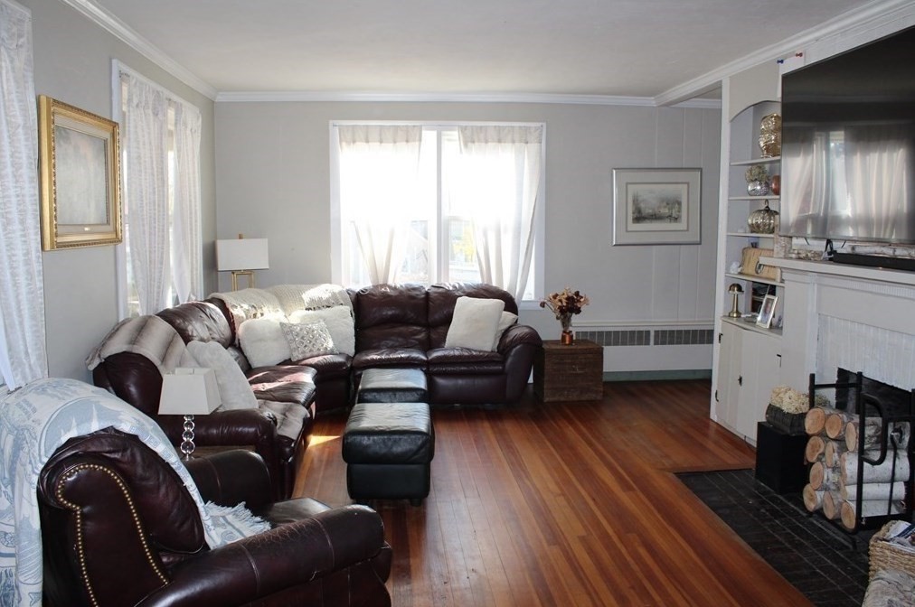 22 Howe Street Hingham, MA 02043 - Photo 8 of 12 a living room with furniture or couch and a window