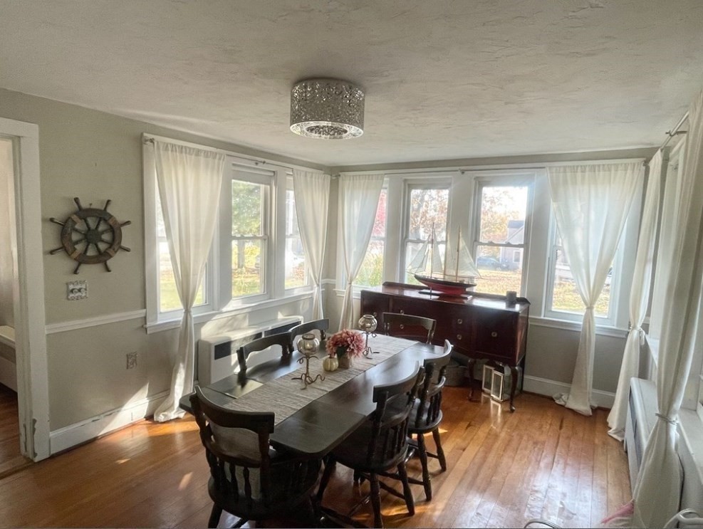 22 Howe Street Hingham, MA 02043 - Photo 9 of 12 a view of a a dining room with furniture window and wooden floor