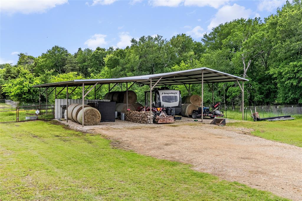 1149 Signal Road Quinlan, TX 75474 - Photo 33 of 40 a view of a wooden deck with chairs and a yard