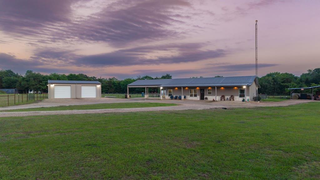 1149 Signal Road Quinlan, TX 75474 - Photo 5 of 40 a front view of a house with a garden