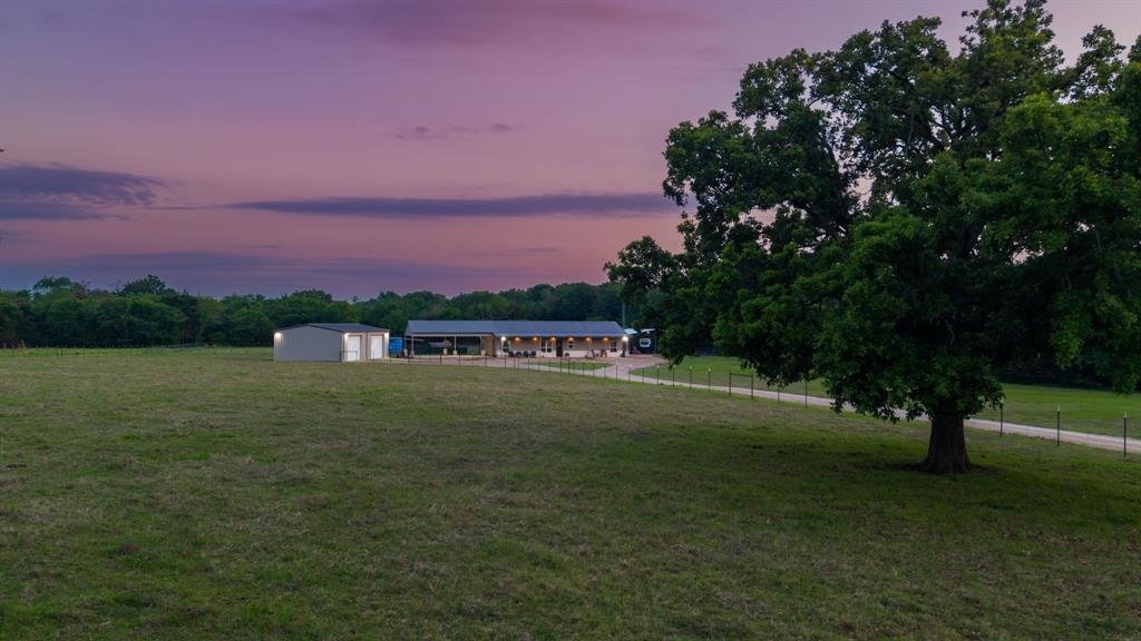 1149 Signal Road Quinlan, TX 75474 - Photo 6 of 40 a pathway to a yard with a house in the background