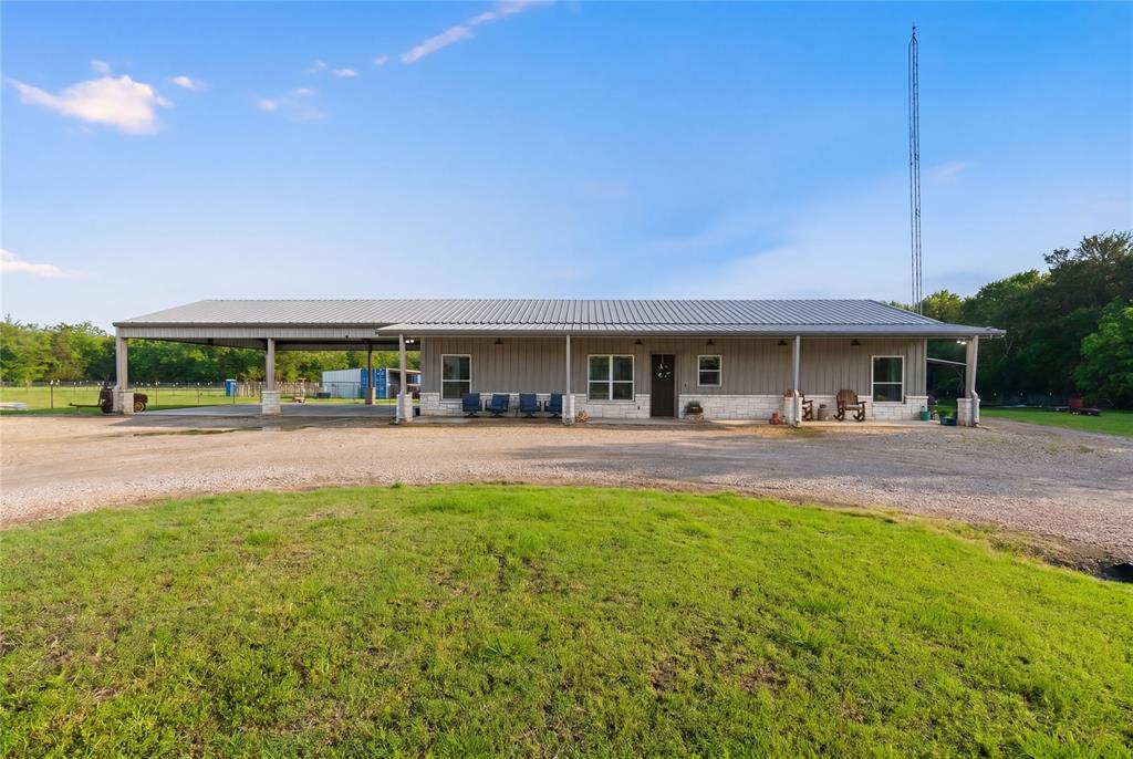 1149 Signal Road Quinlan, TX 75474 - Photo 8 of 40 a view of building with swimming pool and porch