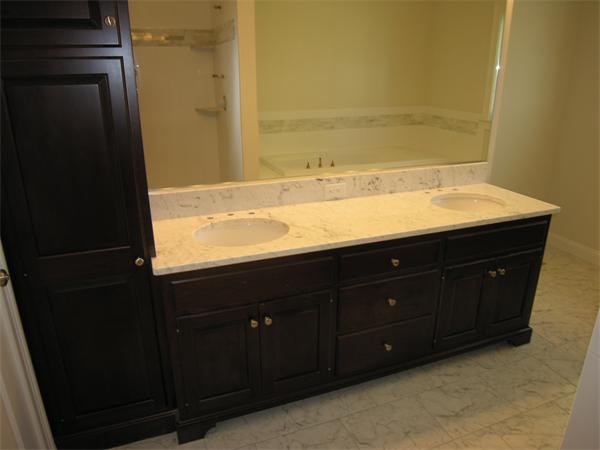 56 Berkshire Road Needham, MA 02492 - Photo 16 of 22 a bathroom with a granite countertop sink and a mirror