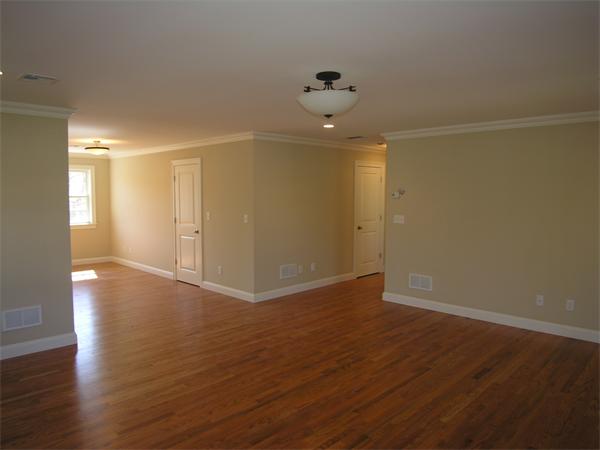 56 Berkshire Road Needham, MA 02492 - Photo 18 of 22 an empty room with wooden floor and windows