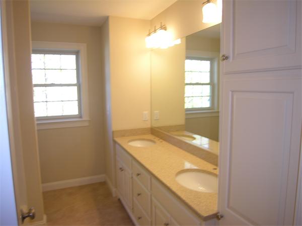 56 Berkshire Road Needham, MA 02492 - Photo 20 of 22 a bathroom with a granite countertop sink and a mirror