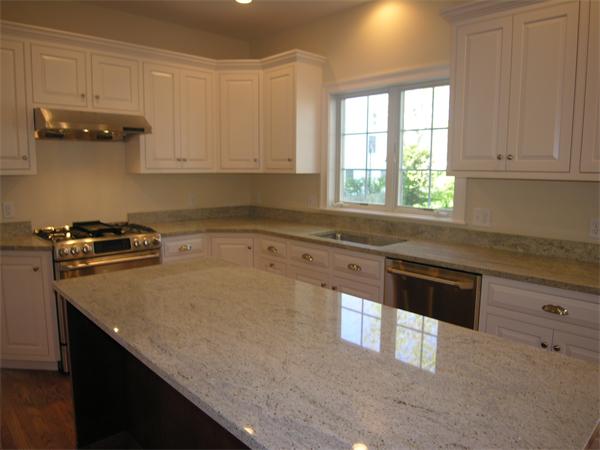 56 Berkshire Road Needham, MA 02492 - Photo 9 of 22 a kitchen with granite countertop a sink a stove and cabinets