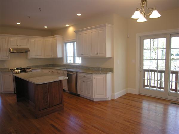 56 Berkshire Road Needham, MA 02492 - Photo 10 of 22 a kitchen with a sink window and cabinets