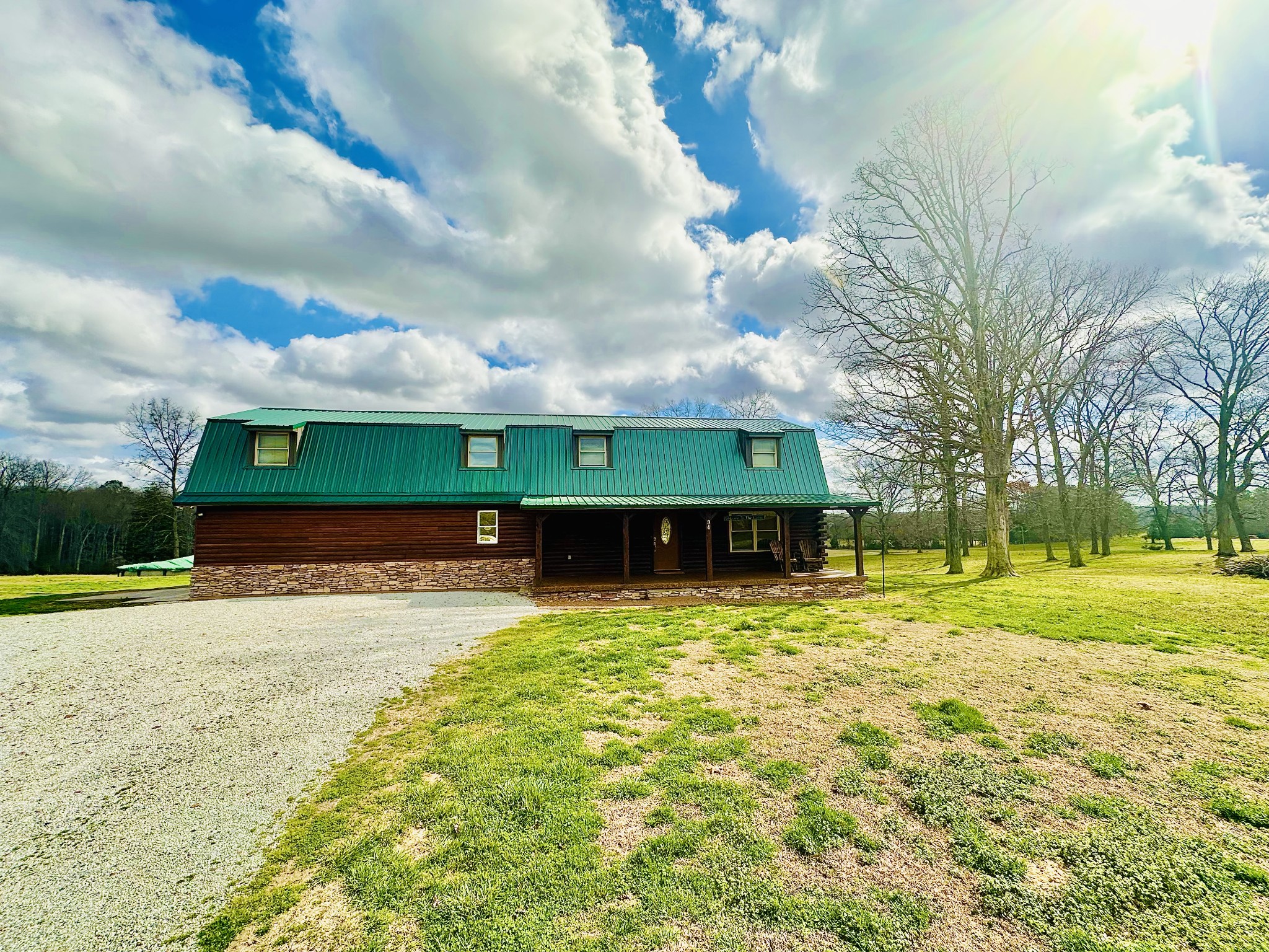94 Oxford Road Holladay, TN 38341 - Photo 46 of 55 a view of a house with a yard and large trees