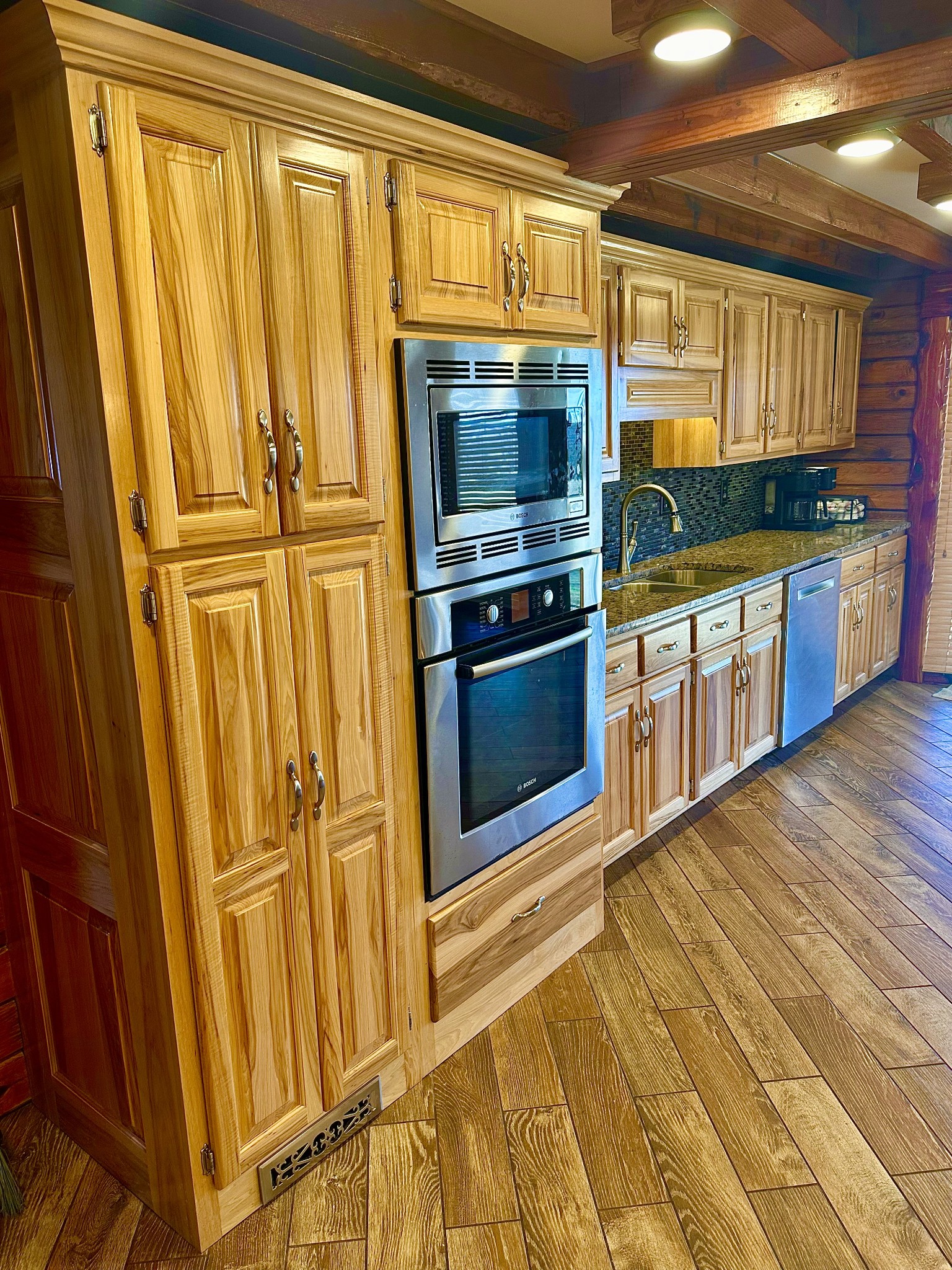 94 Oxford Road Holladay, TN 38341 - Photo 7 of 55 a kitchen with stainless steel appliances granite countertop a refrigerator and a stove