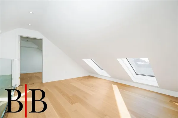 a view of an entryway with a floor to ceiling window