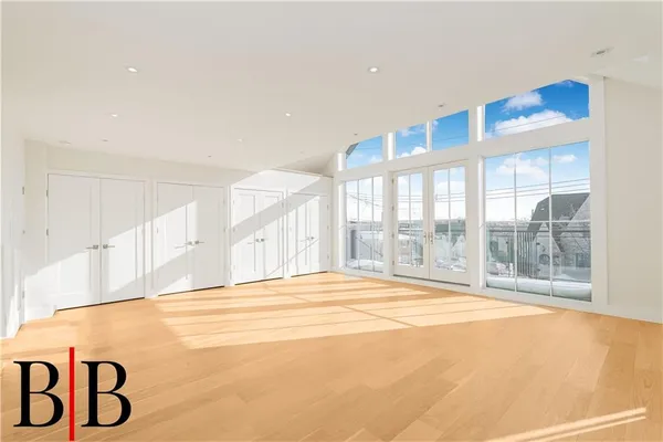 a view of a balcony with wooden floor