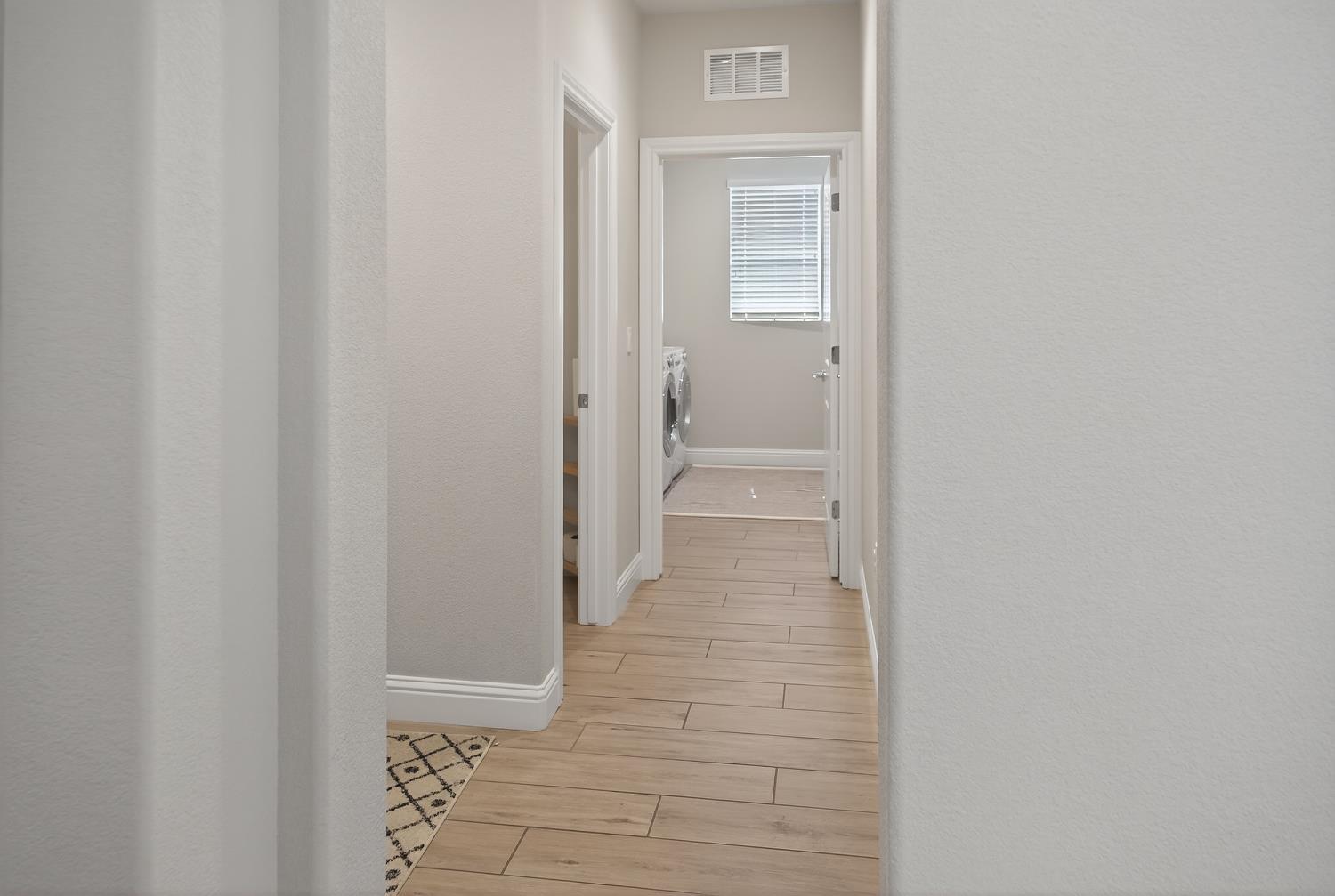 183 Michael Cox Lane Tracy, CA 95377 - Photo 13 of 35 a view of a bathroom from the hallway