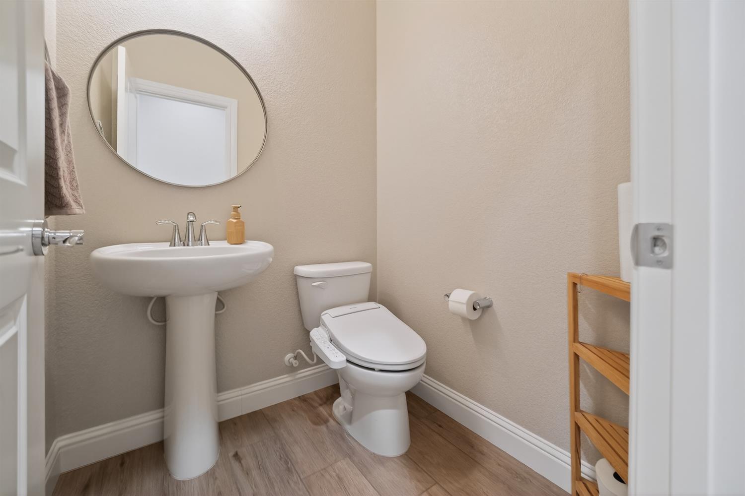 183 Michael Cox Lane Tracy, CA 95377 - Photo 15 of 35 a bathroom with a toilet sink and mirror